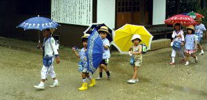 Children with bright umbrellas