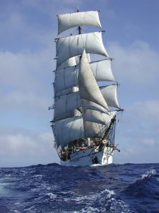 Tall ship with sails raised